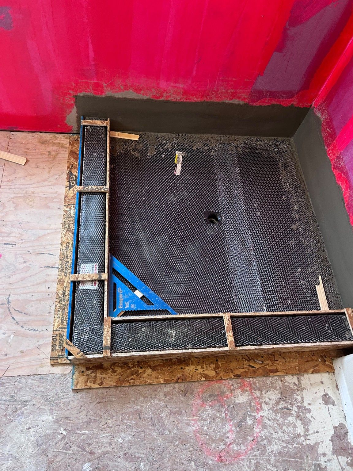 Shower base, curb forms and mesh during installation.