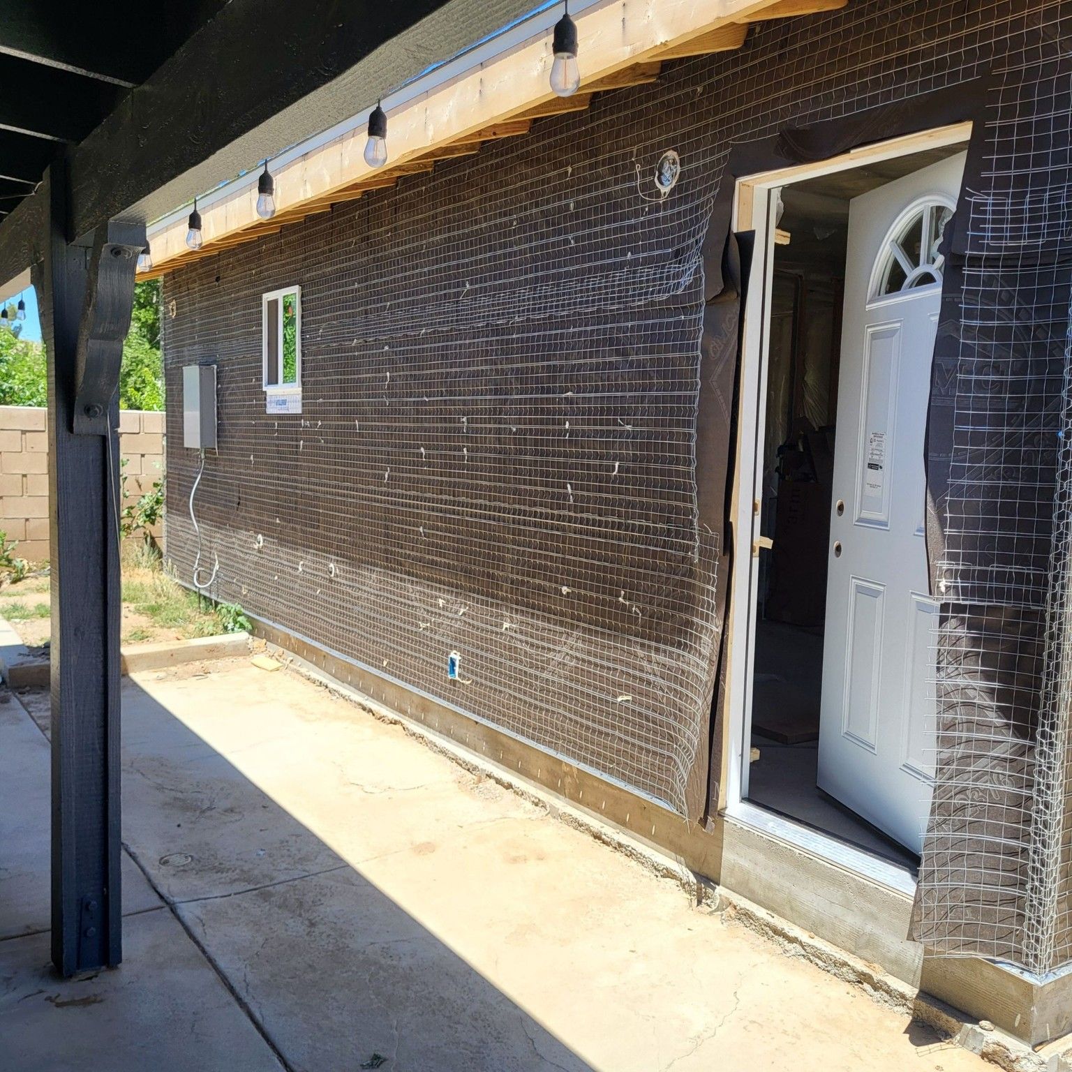 Exterior wall preparation around a door and window