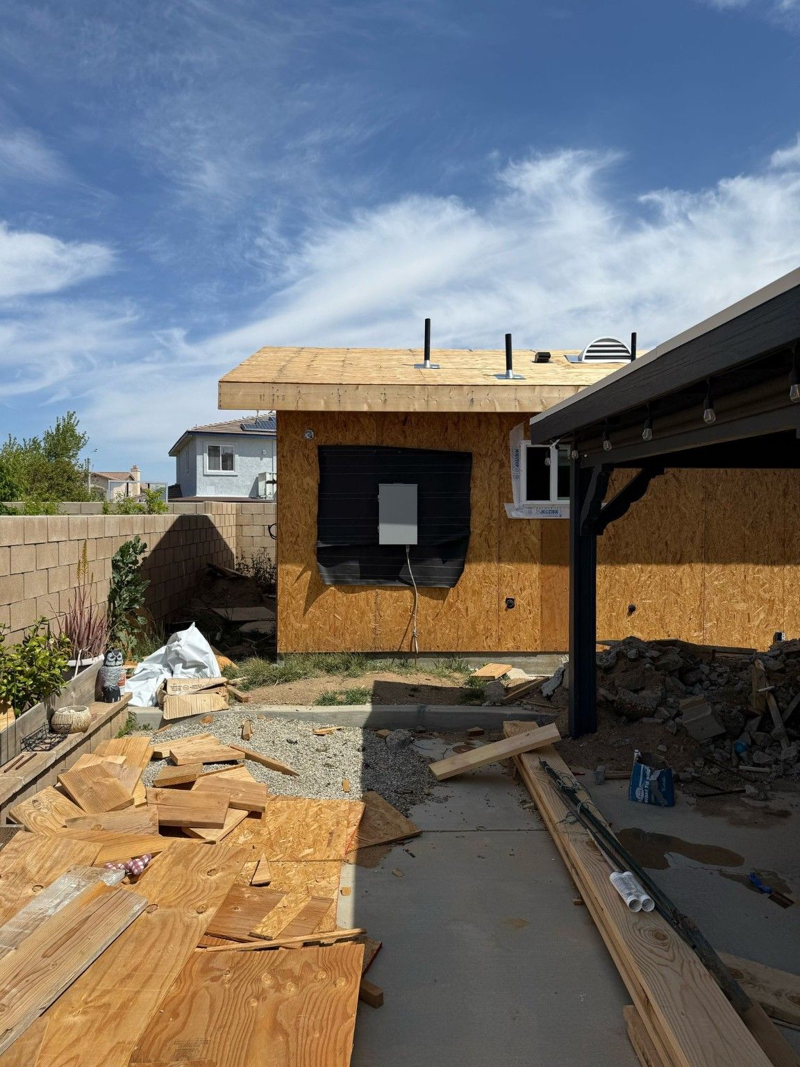 Building exterior during sheathing and window work
